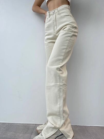 Wearing supermodel legs, American retro high-waisted slimming jeans with leg slits and floor-length jeans, versatile straight-leg trousers for spring and summer.