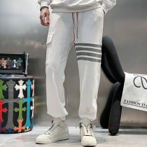 2021 autumn and winter New Trend Fashion small feet slim knitted sweatpants mens European high-end youth printed casual pants