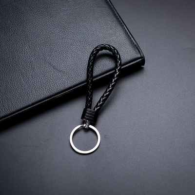 High-grade metal tungsten steel leather rope braided rope keychain creative men and women car handmade pendant event gift