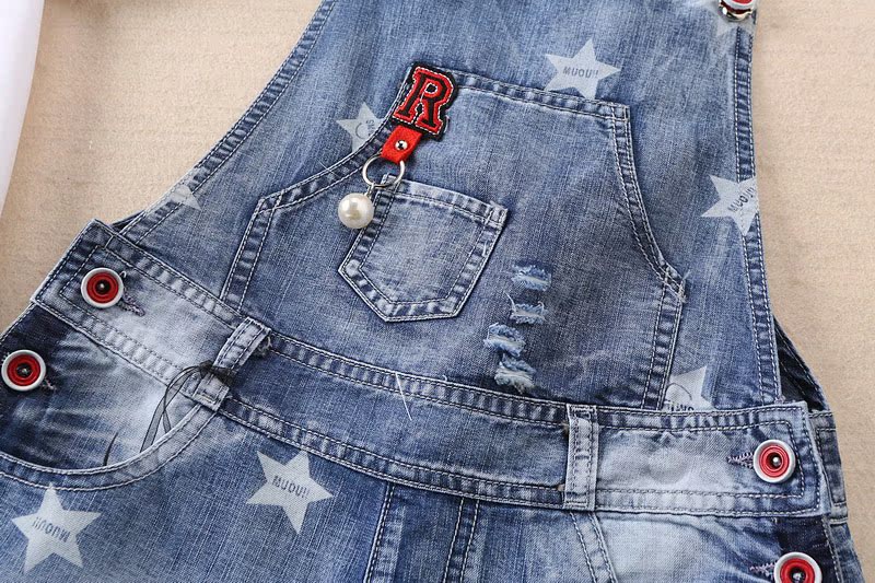 Cô gái denim bib 2018 mới lớn trẻ em mùa hè ăn mặc dây đeo quần short 12-15 tuổi trẻ em mùa hè phù hợp với