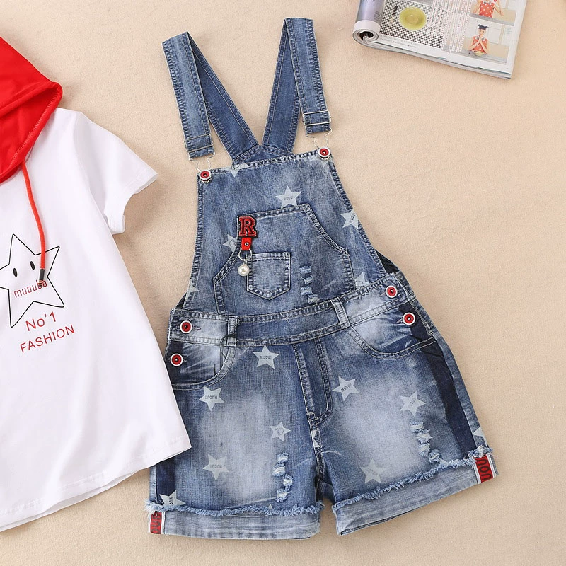 Cô gái denim bib 2018 mới lớn trẻ em mùa hè ăn mặc dây đeo quần short 12-15 tuổi trẻ em mùa hè phù hợp với