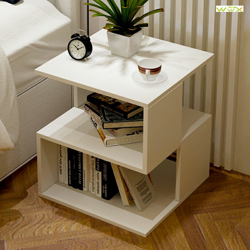 A few simple small tables nears the bedside table livying
