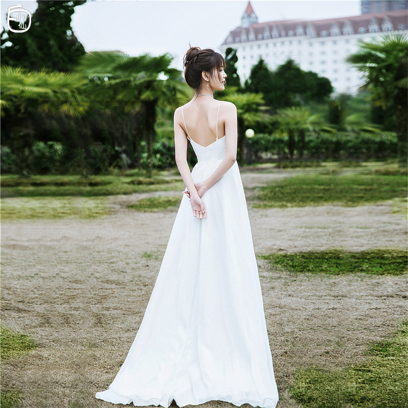(Bai Xiaoxian)light wedding dress 2021 new forest department simple suspender out of yarn seaside travel dating tail dress