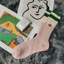 Japans Western Queen Mother Saturn embroidered socks womens middle tube college style stitching spring and autumn color matching calf pile pile socks tide
