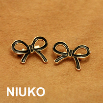 NIUKO accessories metal button accessories exquisite three-dimensional bow pin point black lacquered brooch jewelry