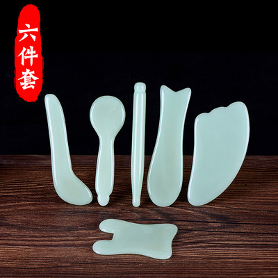 A pair of jade scraping kits massage thin face face fish shaped beauty salon eye tightness