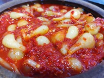 Yunnan Dehong specialty buckwheat head under the meal to teach the head of the hot and sour sweet pepper called the head sweet and sour spicy fried meat