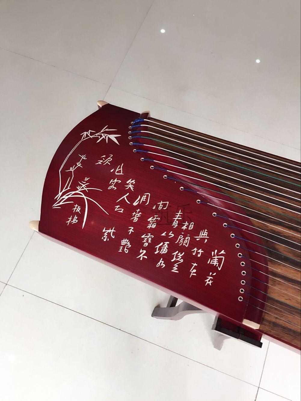 Manufacturer direct sales portable red wood lettering 125 type of clear sound elegant and elegant small guzheng teaching to play zither mini-zither