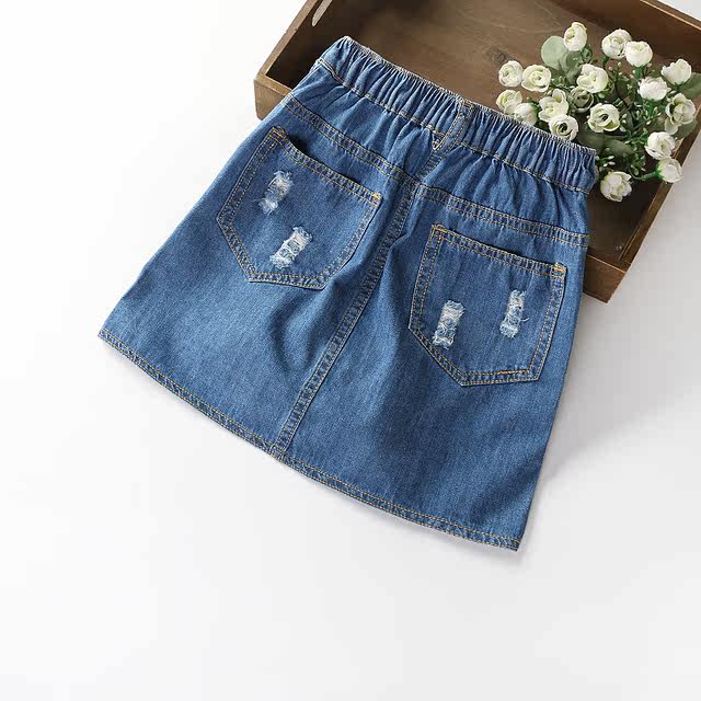 ເດັກຍິງ denim skirt 2019 summer ແບບໃຫມ່ buttoned hole denim ສັ້ນ skirt denim skirt ເດັກນ້ອຍ hip skirt