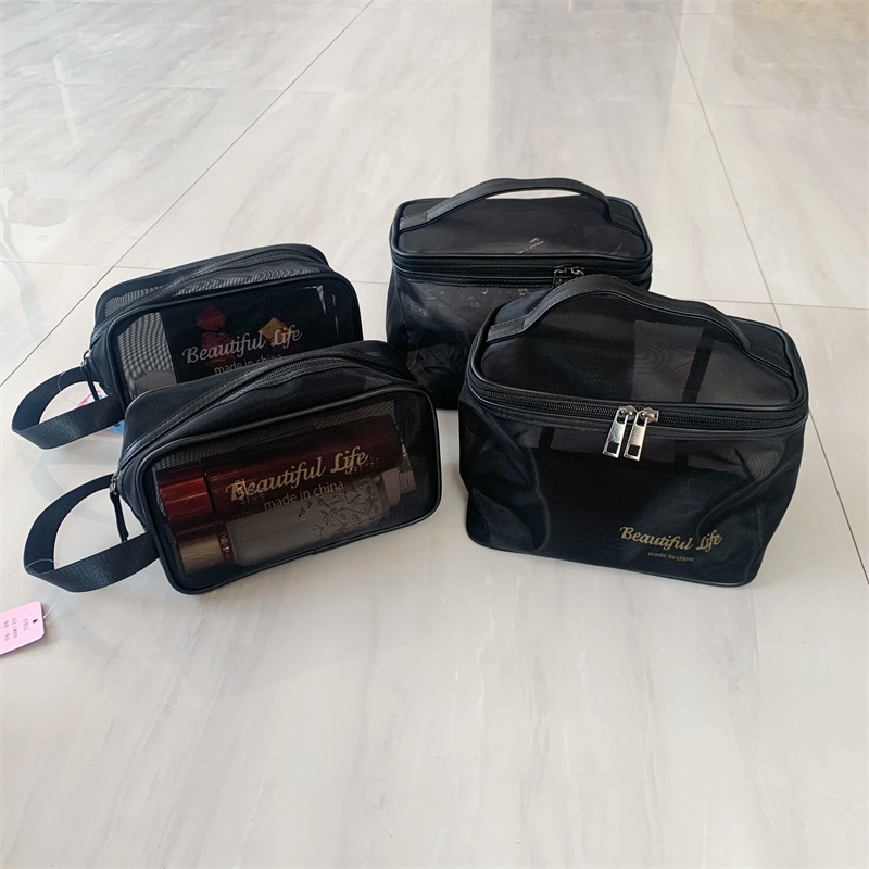 2020 new Japan-ROK portable transparent letter mesh yarn makeup bag hand large capacity travel color makeup storage bag