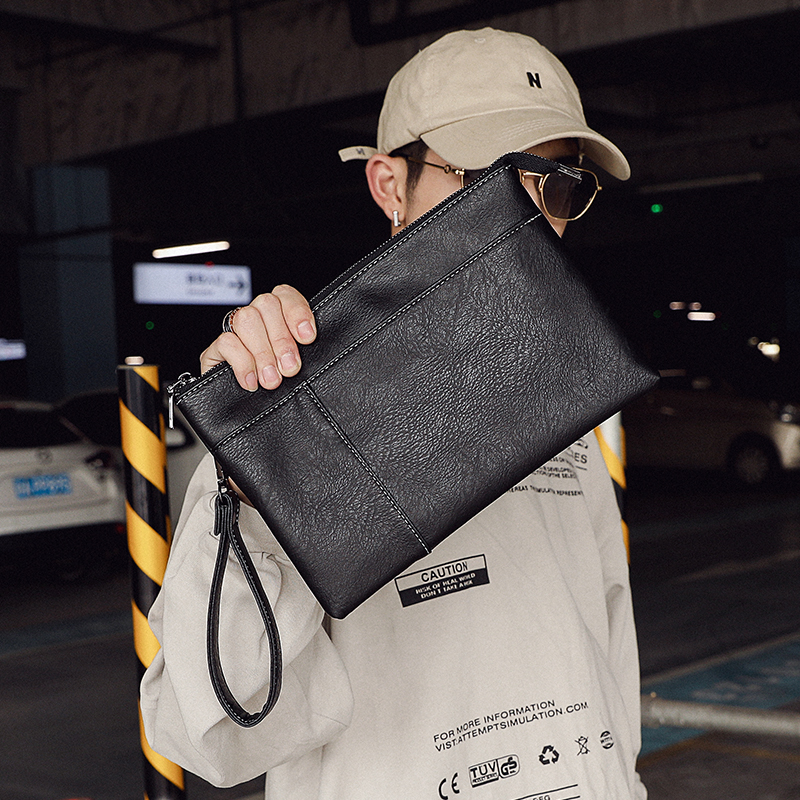 Hong Kong I Tgreg men's handbag Handbag Leather handbag Business Leisure Letter Enveloping Nets Red young hands to catch the wave