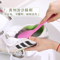 A long-handled cleaning brush