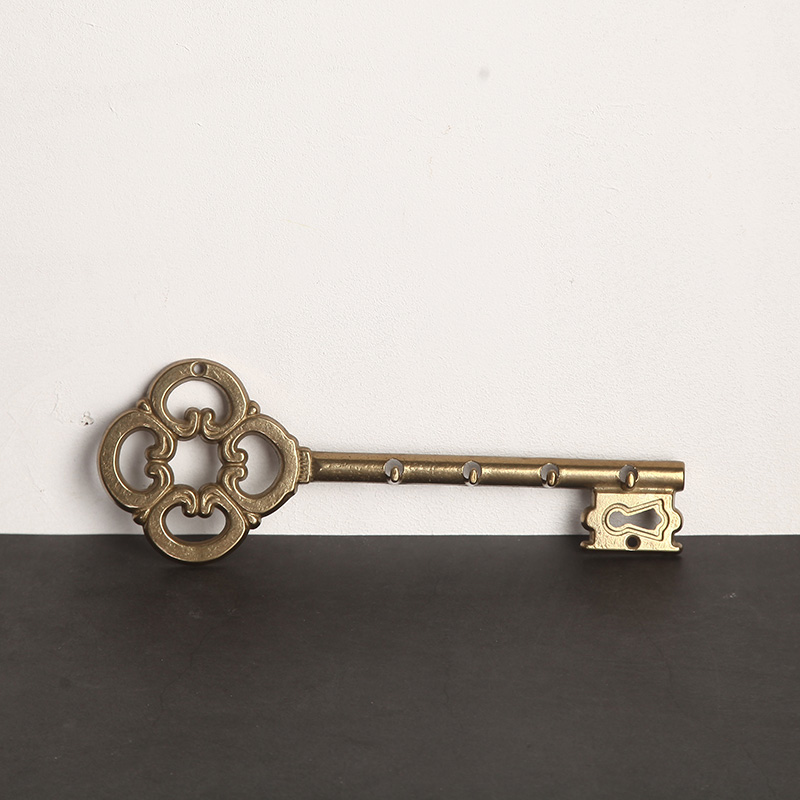 The European antique bronze key is linked to the other.