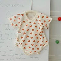 Жаккардовая хлопчатобумажная ткань антикварного красного цвета с сердечками.