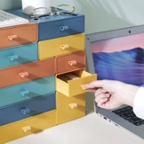 Нарисовать настольные настольные ящики для хранения настольных компьютеров косметика Студенческая общежитие столовые канцелярские канцелярские товары, установленные в Office Office, может быть наложено.