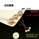 Áo len mới của Nhật Bản và Hàn Quốc Áo len xoay xoay đơn giản Pearl Trâm áo cổ áo Pin nữ Váy ngắn