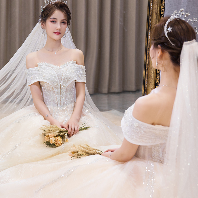 A word shoulder wedding dress 2023 new bride temperament drag tail of a large number of pregnant women French light white spring and summer