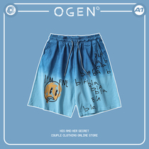 OGEN Club21SS tide brand men and women with the same loose graffiti smiley face design gradient shorts