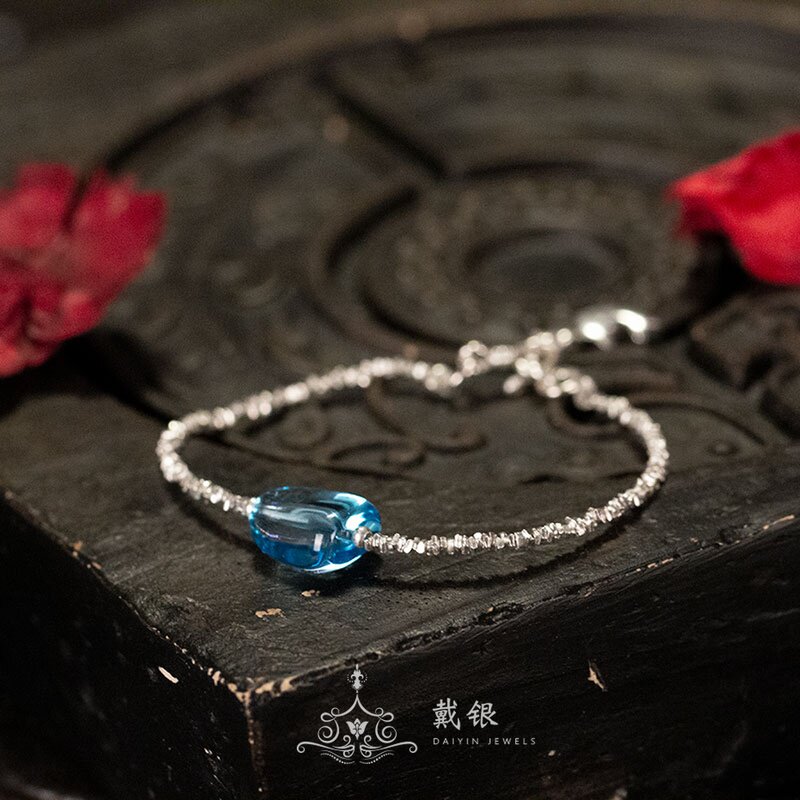 Wearing silver jewellery fine and fine sweet and pure silver handmade honey wax handstring girl with small hand alchemy red concolade