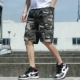 Quần short nam mùa hè Phong cách Hàn Quốc mặc bên ngoài thương hiệu quần thủy triều lỏng lẻo quần năm điểm overalls quần thể thao giản dị - Quần short