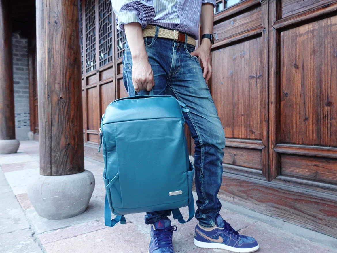 Ultra light leather physiological warm jeans, capacious laptop, backpack