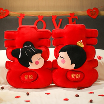 A pair of double happiness pillows and bed dolls. Traditional Chinese red wedding bed decoration wedding room dolls as gifts for newlyweds.
