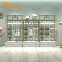 Lingerie Shelves Display Cabinet Bra Pyjamas Overhead Tennis Red Lingerie Shop Racks Up Against Wall Golden Light Lavish Shelves