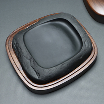 Old pit ink with shape stone pool inkle under the shape of the pit in the fine corrugated pit in small-scale handmade practical inkstand