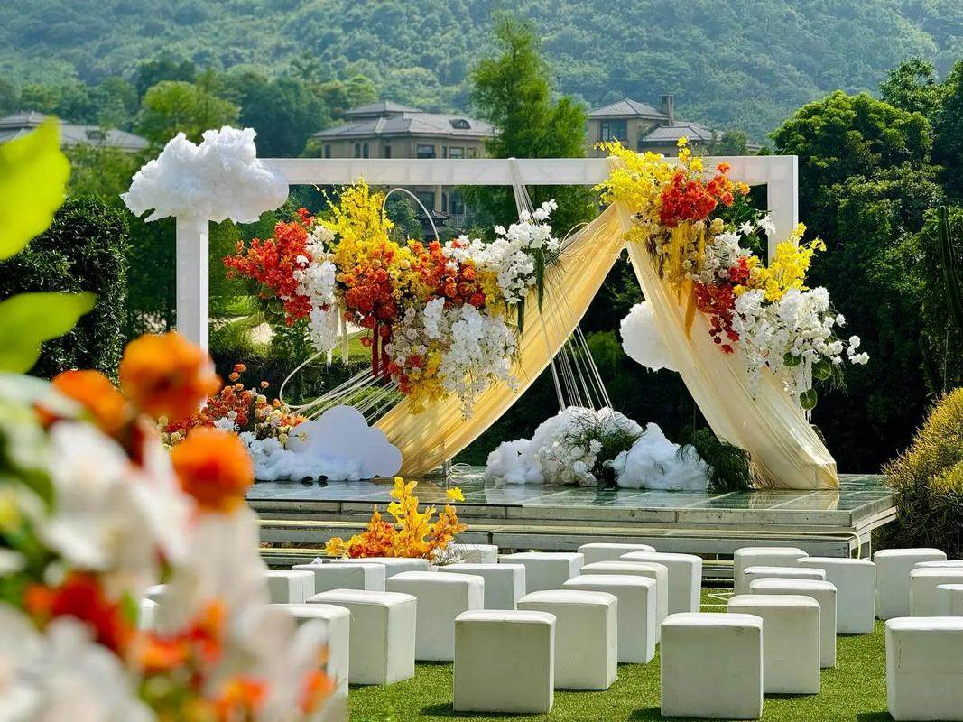 Intimate wedding table decor with neutral linens, candles, and simple floral arrangements