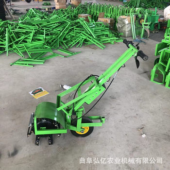 Elderly woman hand-pushed electric lawn mower for land reclamation, rotary plow, 48 lithium battery orchard soil loosening, weeding and micro tillage