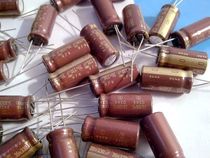 Brand new brown robe gold word ELNA 35V 330UF