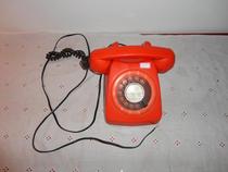 Old orange dial phone classic collection of film and television props   window furnished