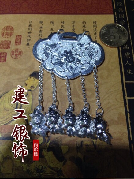 The baby is a year old wearing a handmade chisel-patterned card shoe-sheet