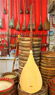 Xinjiang musical instruments Uighur handmade national musical instruments Dutar plays standard piano Student piano