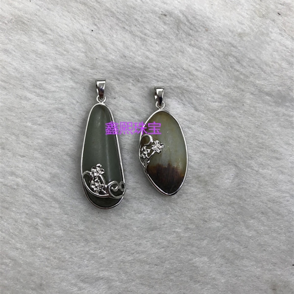 Sterling silver hand-wrapped pendant with stone inlaid with various irregular jade and Hetian jade seed material processing to cover residual cracks