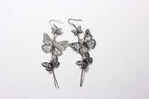 (Kill Mary Sue) Xianwei full Earth cool silver long hollow butterfly earrings metal texture