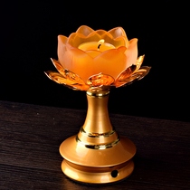 There is a Buddha with alloy glass lamp holder for Buddha lotus candle holder In front of the Buddha long light butter lamp base lamp holder