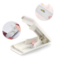 The medicine cutter can fix the tablet divider can make a mini plastic dispenser box