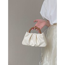 Cone Koery genuine leather 2022 new wood handle pleated cloud Dove hand woman single shoulder inclined satchel mini packet bag