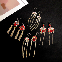 Chinese style Daoma Dan face earrings womens red New Year flavor theme temperament long tassel earrings net red