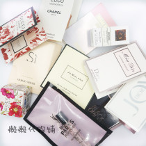 Hand with perfume sample collection test tube perfume Q fragrance (1)