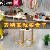 Clothing store window display rack display rack golden rack high and low shoes bag middle island display table running water table decoration