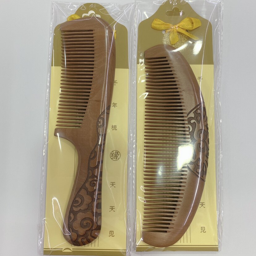 Only send Xinjiang spot boutique thickened peach wood comb double-sided carving peach wood household comb