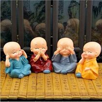 Four little monk car ornaments center console foreground creative high-grade male net red car shaking his head Car interior jewelry
