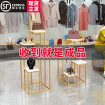 Clothing store window decoration high and low shoes and bags display stand golden creative net red free installation Nakajima water table