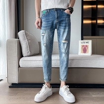 Summer new mens jeans slim-fit pants mens Korean version of the trend hole pants raw edge beggars pencil pants nine-point pants