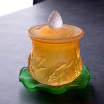 There is a Buddha with imitation glass relief lotus flower holy water cup Buddhist hall ornament Buddhist supplies Guanyin water purification cup