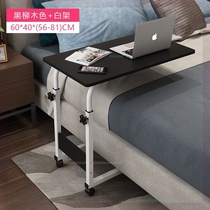 On the bed an extra-large laptop desk can be placed on the keyboard to lift the multi-purpose dormitory lazy person with a small desk