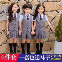 Kindergarten class clothes Summer children start in the garden to take pictures of the six first-year elementary school childrens school uniform gown