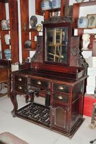 During the Republic of China period a Western-style Nampa wood dresser and cabinet carved with the Kuomintang*party flag (Bao Zhen Bao Lao)